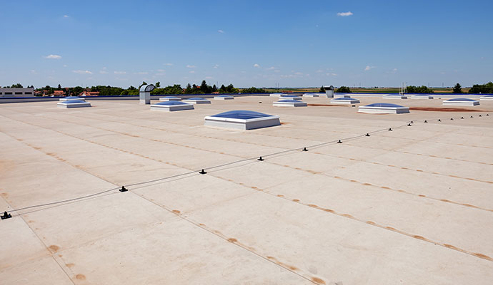 Large flat roof with multiple ventilation units