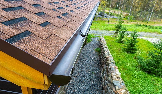 Clean gutter installed along a residential roofline