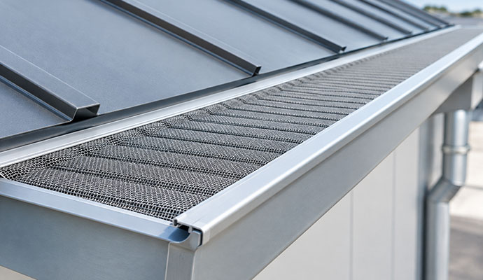 Micro mesh gutter guard installed on a commercial metal roof
