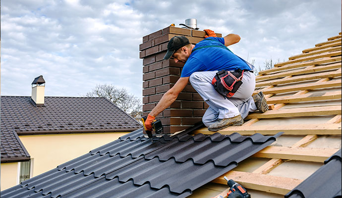 Metal roofing installation around chimney