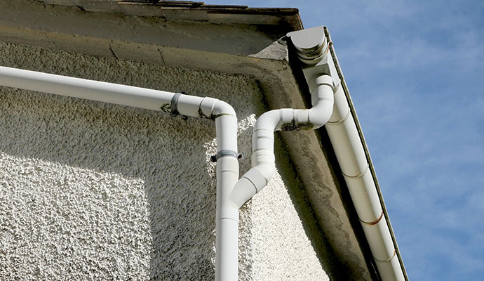 White PVC downpipe gutter connection