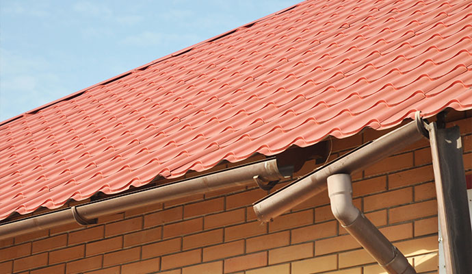 Broken gutter red tile roof