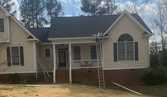 The Lifetime Gutter is being installed on a house