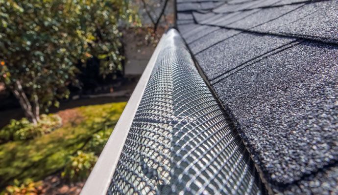 Installed reverse curved gutter guard
